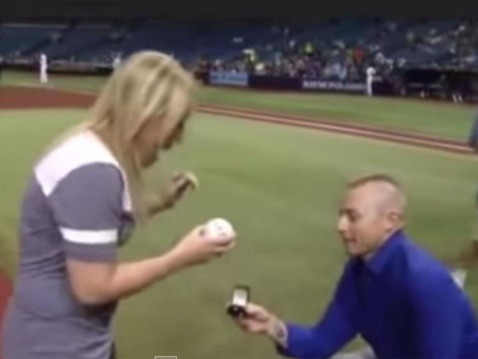 Cameron Hill scribbled the words 'will you marry me?' on a baseball to propose in 2015 YouTube