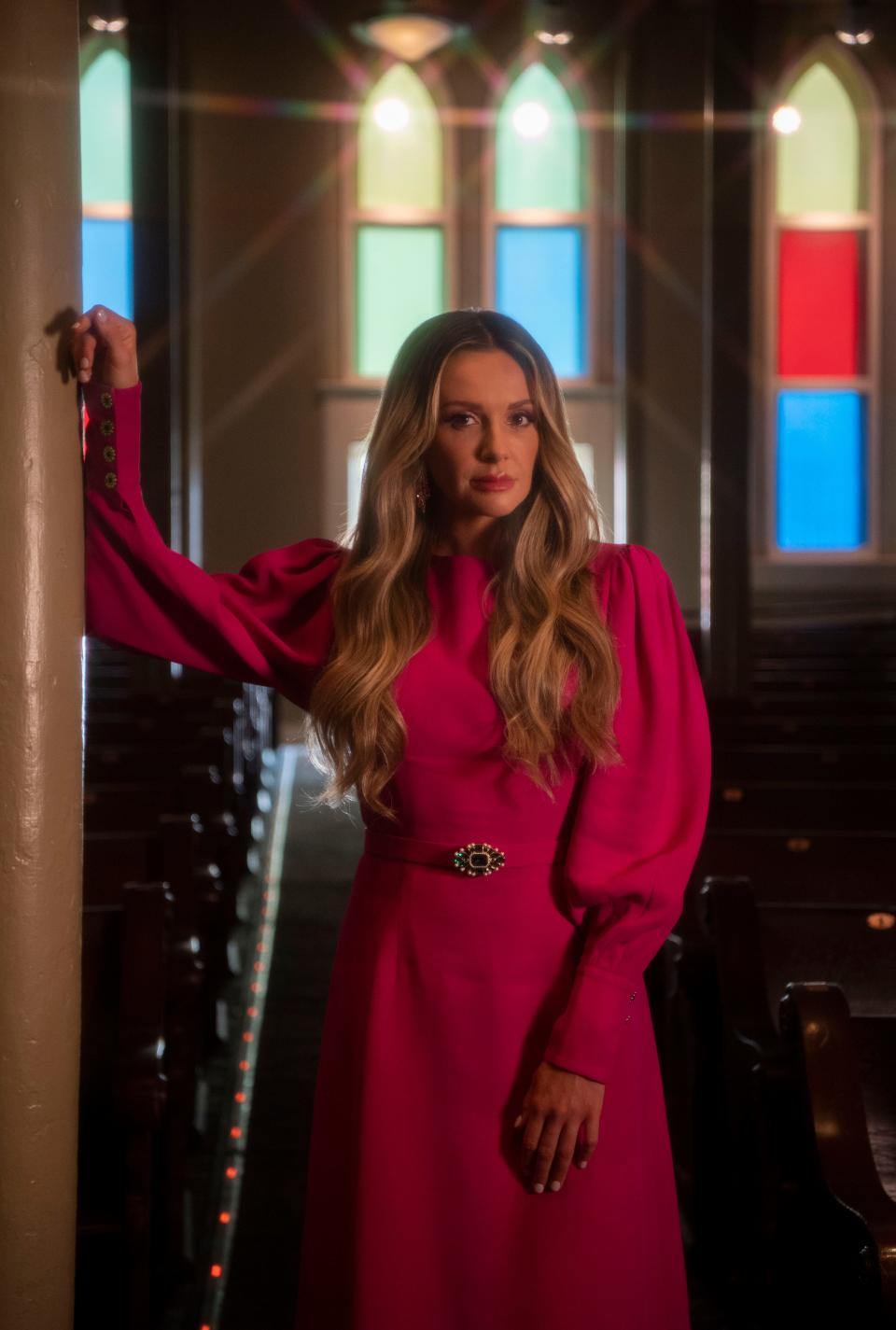 Carly Pearce stands inside at the Ryman Auditorium in Nashville , Tenn., Friday, Oct. 7, 2022.