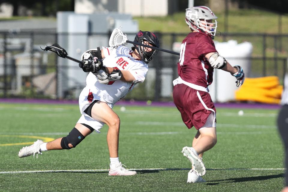 Rye's Owen Kovacs (8) fires a shot against Garden City   during the boys lacrosse Class B state semifinal at University of Albany June 8, 2022.  Garden City won the game 6-4.