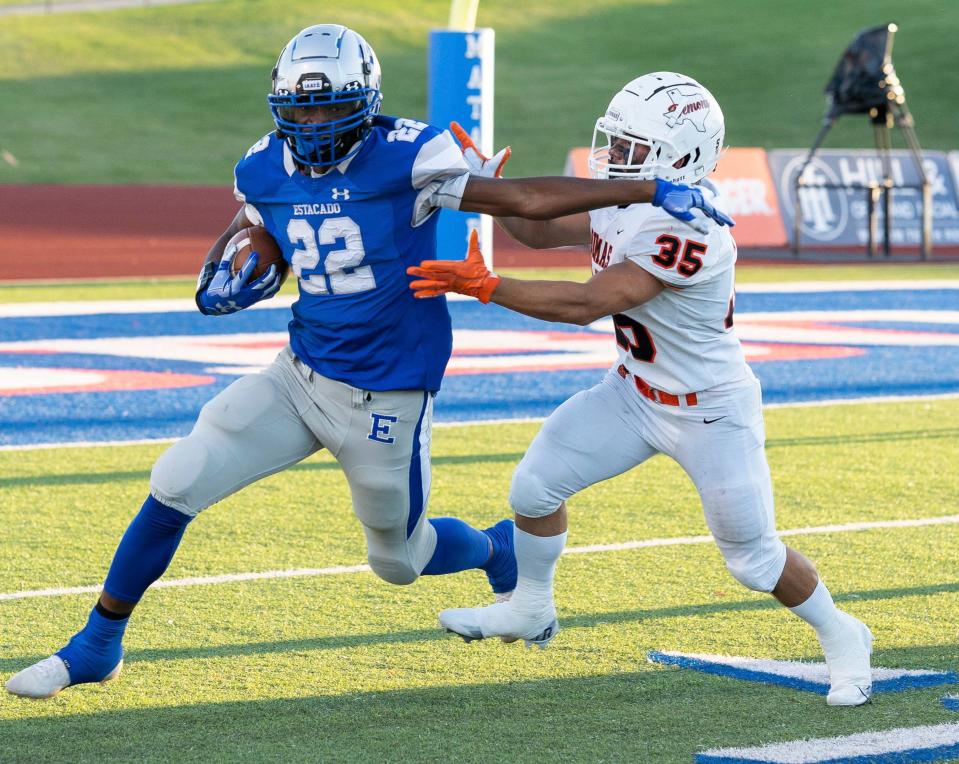 Estacado's Bobby Ross looks for room against Dumas's Sabien Perry, Friday, Sept. 2, 2022, at PlainsCapitol Park at Lowrey Field. Dumas wins, 34-7.