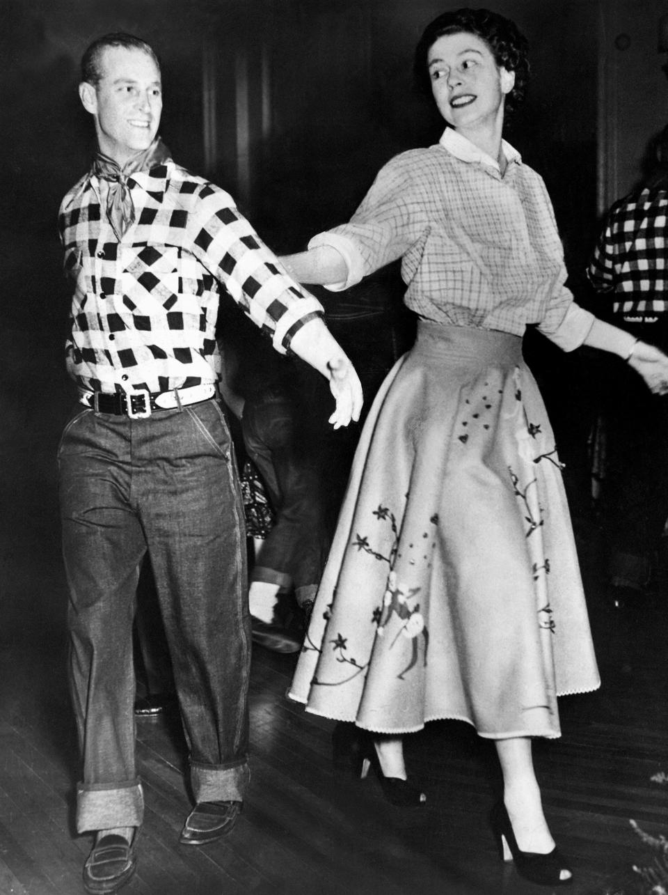 Princess Elizabeth wearing a poodle skirt with the Duke of Edinburgh at a hoedown in Ottawa, 1951