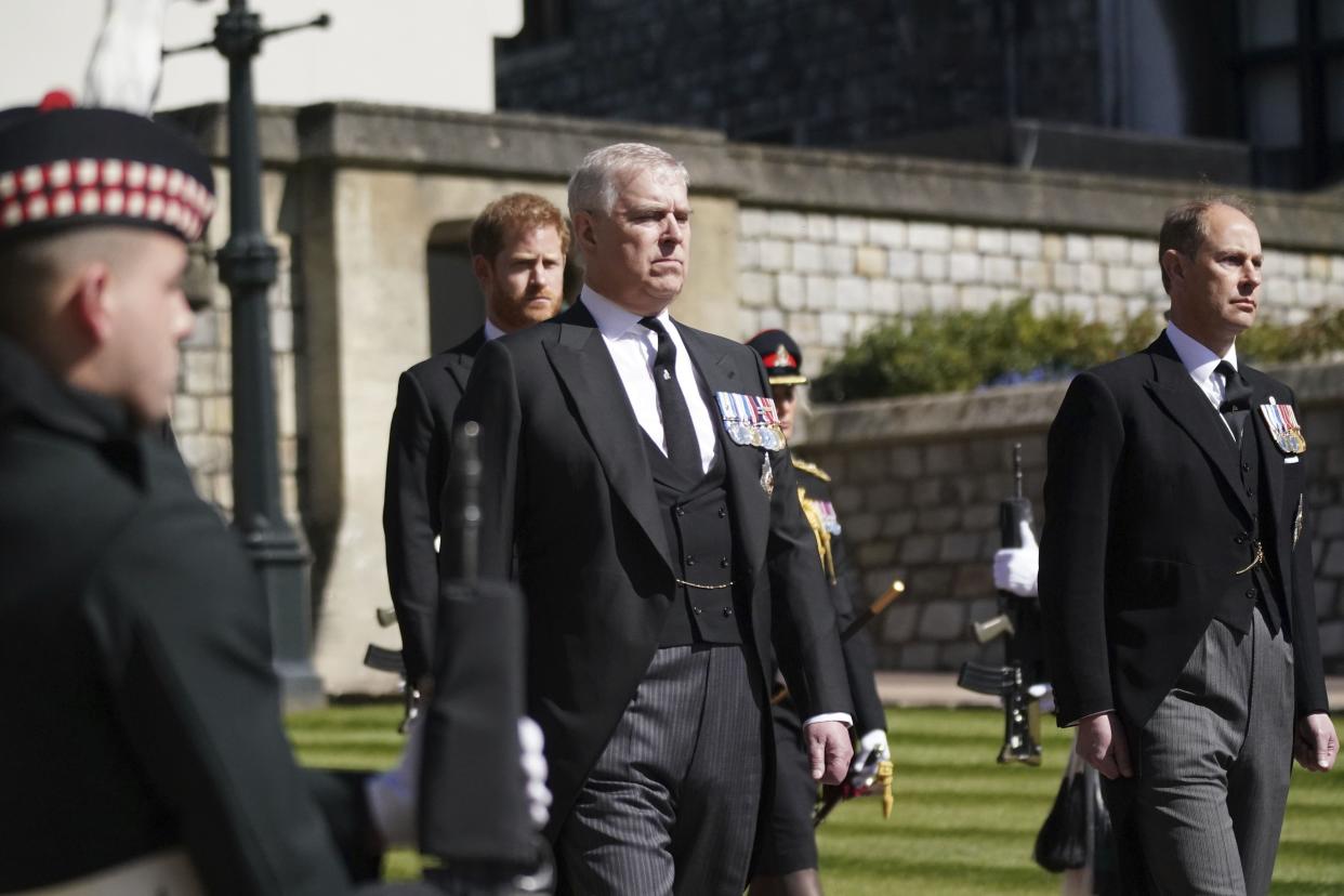 Prince Andrew, center, Prince Harry  and Prince Edward, in the procession ahead of Britain Prince Philip's funeral at Windsor Castle, Windsor, England, Saturday April 17, 2021.