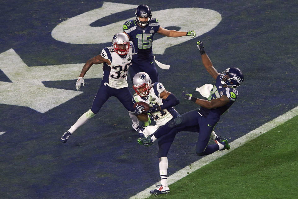 On what looked to be a game-winning drive by the Seattle Seahawks late in Super Bowl XLIV on Feb. 1, 2015, New England Patriots cornerback Malcolm Butler intercepts the ball on the goal-line to clinch an unlikely fourth Super Bowl title for the Pats.<span class="copyright">John Iacono—Sports Illustrated/Getty Images</span>