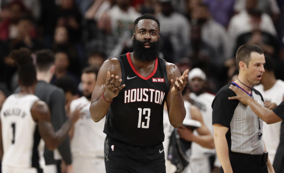 Houston Rockets guard James Harden (13) questions a call during the second half of an NBA basketball game against the San Antonio Spurs, in San Antonio, Tuesday, Dec. 3, 2019. San Antonio won 135-133 in double overtime. (AP Photo/Eric Gay)