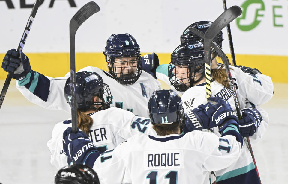 New York players celebrate a goal by Jaime Bourbonnais against Montreal during the second period of a PWHL hockey game Tuesday, Jan. 16, 2024, in Laval, Quebec. (Graham Hughes/The Canadian Press via AP)