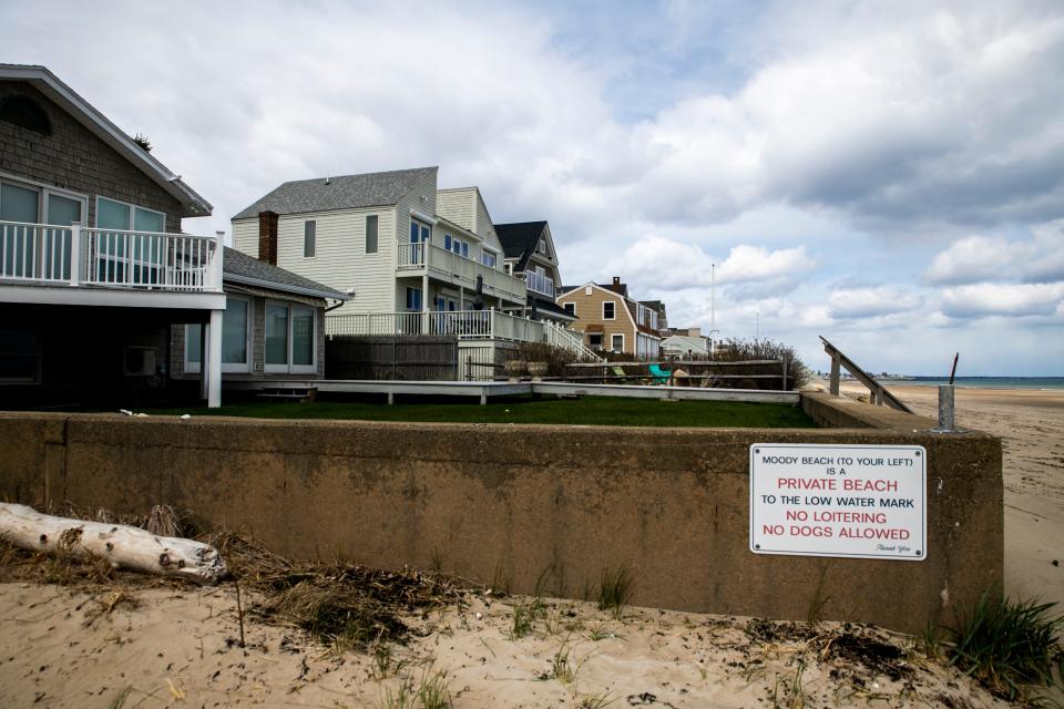 A sign posted at the Wells/Ogunquit town line marks the boundary between the public and private beach Thursday, April 22, 2021.