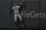 Los Angeles Dodgers center fielder James Outman catches a fly ball by St. Louis Cardinals' Paul Goldschmidt at the wall during the sixth inning of a baseball game Friday, May 19, 2023, in St. Louis. (AP Photo/Jeff Roberson)