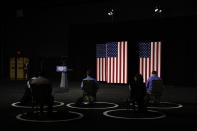 People wait for Democratic presidential candidate, former Vice President Joe Biden to speak at a campaign event, Tuesday, July 14, 2020, in Wilmington, Del. (AP Photo/Patrick Semansky)