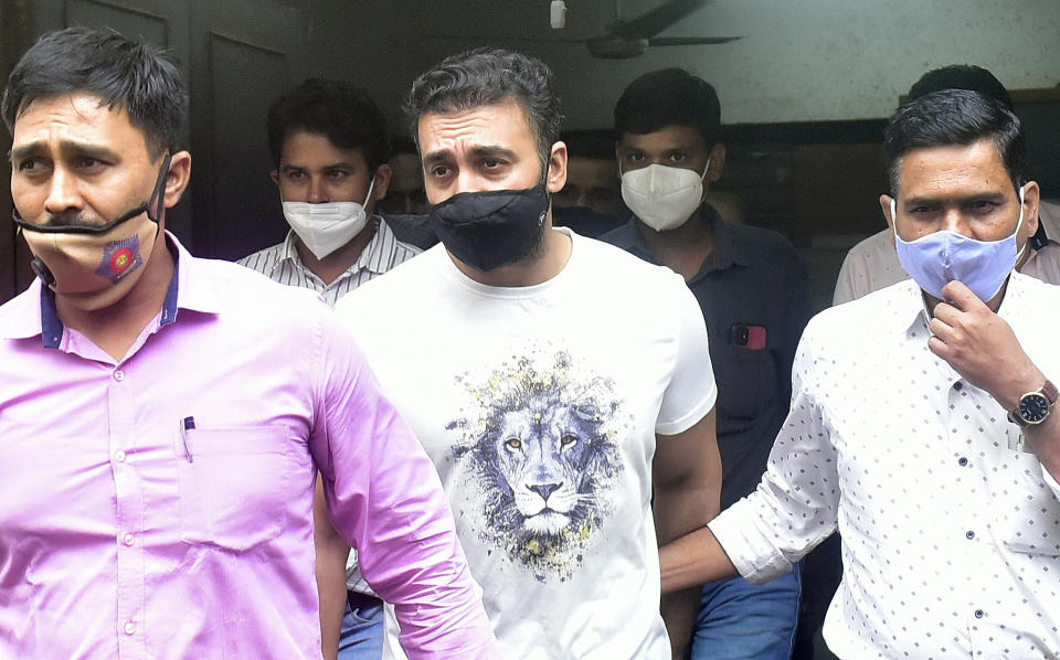 MUMBAI, INDIA - JULY 23: Raj Kundra being taken to Killa Court from Property Cell Unit office at Byculla in Porn Racket case on July 23, 2021 in Mumbai, India. Actress Shilpa Shettys husband Kundra and his business associate Ryan Thorpe were produced before the Magistrate Court at the end of their earlier three-day police remand on Friday. Police sought an extension of their custody to probe the matter further. The police had earlier told the court that the 45-year-old businessman was gaining financially from the illegal activity of making and selling pornographic material. (Photo by Anshuman Poyrekar/Hindustan Times via Getty Images)