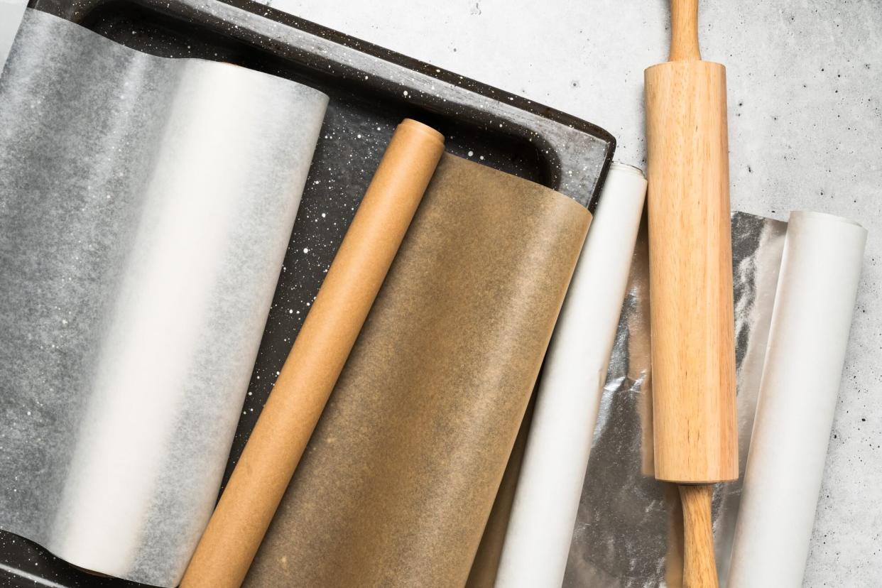 aluminium foil, parchment paper, baking paper on counter