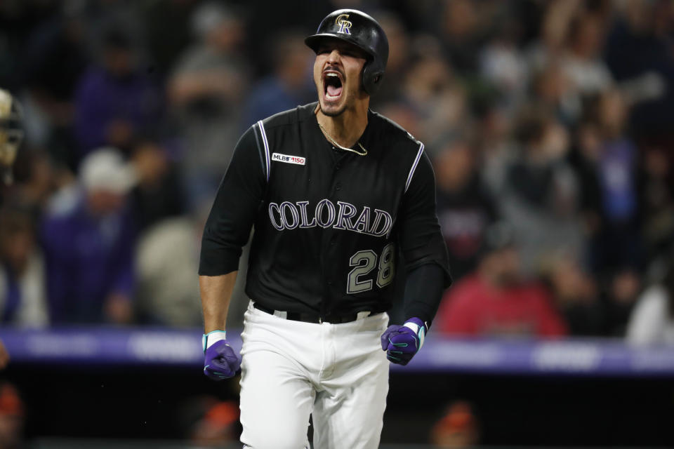 Colorado Rockies' Nolan Arenado reacts after hitting a solo home run off Baltimore Orioles relief pitcher Shawn Armstrong in the seventh inning of a baseball game Friday, May 24, 2019, in Denver. (AP Photo/David Zalubowski)
