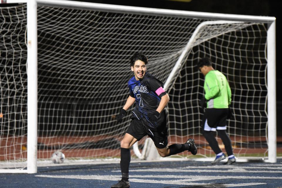 Cobalt Institute of Math & Science Academy's Daniel Lopez celebrates after scoring a penalty kick to seal the team's lead against Hawthorne MSA in second round of CIF-Southern Division 7 playoffs on Tuesday, Feb. 13, 2024 in Victorville. CIMS won 2-0 and advanced to the to the quarterfinals.