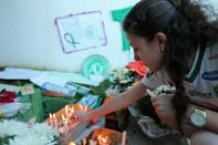 <p>Fans pay tribute to the players of Brazilian team Chapecoense Real who were killed in a plane accident in the Colombian mountains, at the club’s Arena Conda stadium in Chapeco, in the southern Brazilian state of Santa Catarina, on November 29, 2016. </p>