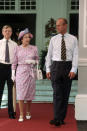 <p>Looking lovely in pink and lilac, this simple summer outfit (and jaunty hat) must have kept the Queen cool during a tour of Singapore. <i>[Photo: Rex]</i></p>