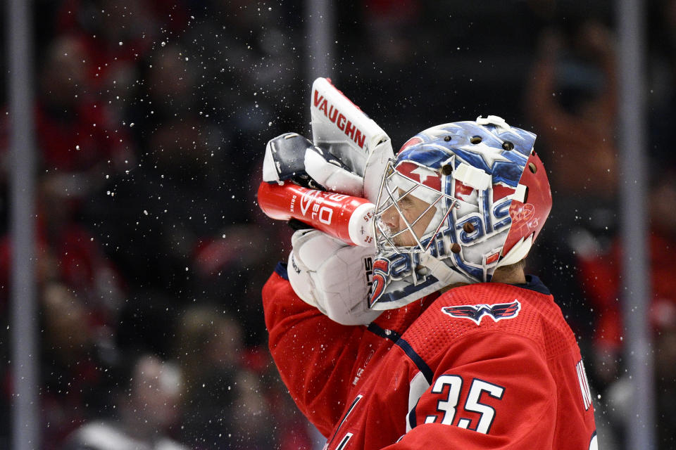 Washington Capitals goaltender Darcy Kuemper gets a drink during the second period of a preseason NHL hockey game against the Columbus Blue Jackets, Saturday, Oct. 8, 2022, in Washington. (AP Photo/Nick Wass)