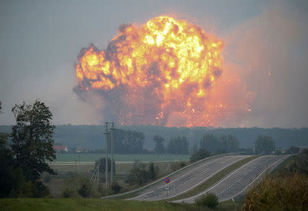 Smoke and flames rise over a warehouse storing ammunition for multiple rocket launcher systems at a military base in the town of Kalynivka in Vinnytsia region, Ukraine September 27, 2017. REUTERS/Gleb Garanich TPX IMAGES OF THE DAY