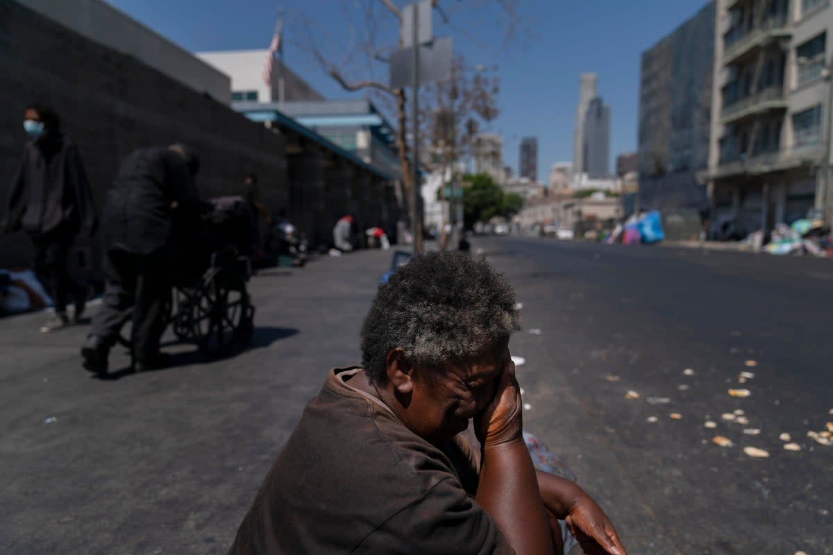 Dorothy O'Bannon wipes her face in the Skid Row area of Los Angeles during the current heatwave  (Copyright 2022 The Associated Press. All rights reserved)