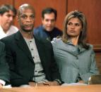 FILE PHOTO: New York Yankees outfielder Darryl Strawberry sits in a court in Tampa. He pleaded no contest to charges of cocaine possession and solicitation for prostitution and was sentenced to 18 months probation and community service.