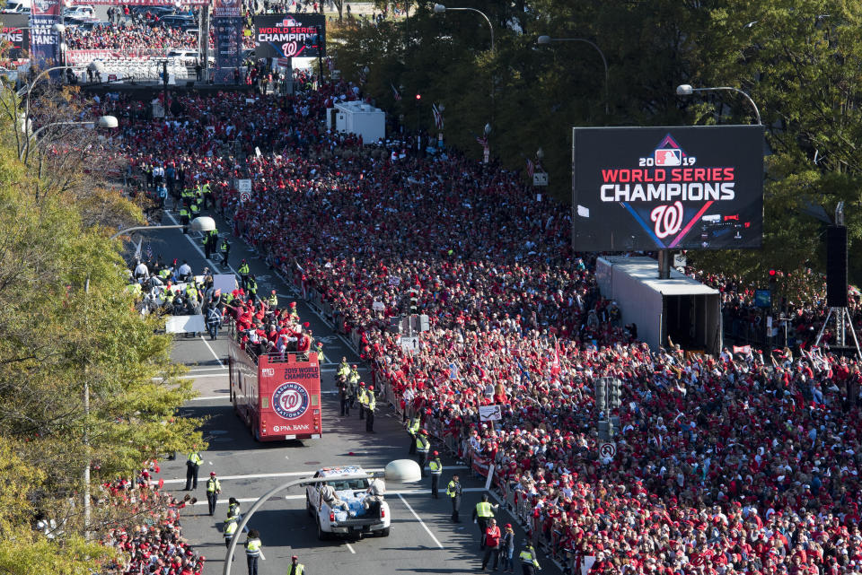 The MLB Washington Nationals celebrate the team's World Series baseball championship over the Houston Astros, with their fans in Washington, Saturday, Nov. 2, 2019. The Washington Nationals are getting a hero's welcome home from a city that had been thirsting for a World Series championship for nearly a century.(AP Photo/Cliff Owen)