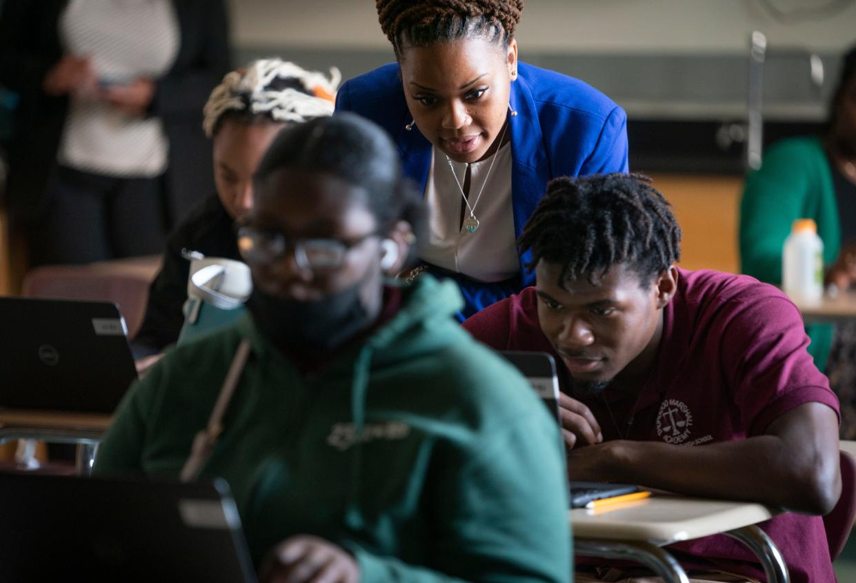 Biology teacher Samantha Koonce Gaines, helps students with questions and offers encouragement during a virtual physics class in May at the Thurgood Marshall Academy Public Charter High School in Washington, D.C.