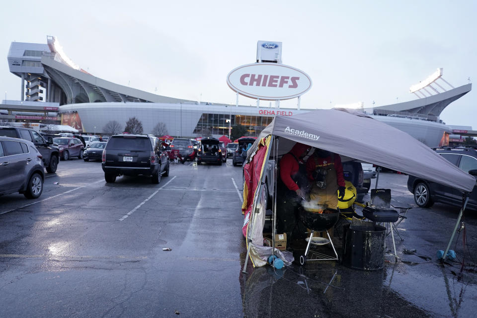 Fans tailgate outside of Arrowhead Stadium before an NFL wild-card playoff football game between the Kansas City Chiefs and the Miami Dolphins Saturday, Jan. 13, 2024 in Kansas City, Mo. (AP Photo/Charlie Riedel)