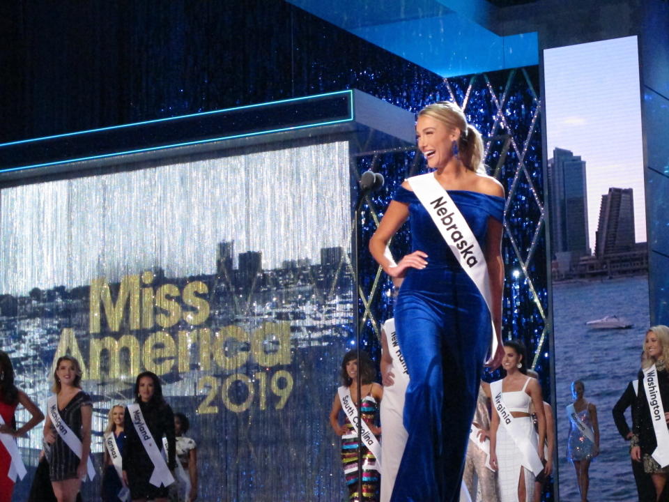 Miss Nebraska Jessica Lynn Shultis introduces herself at the start of the third and final night of preliminary competition at the Miss America competition in Atlantic City N.J. on Friday Sept. 7, 2018. (AP Photo/Wayne Parry)