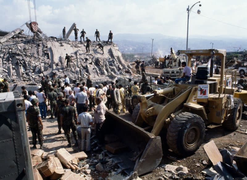 This is the scene around the U.S. Marine base near Beirut airport on Oct. 23, 1983 following a massive bomb blast that destroyed the base and caused a huge death toll rising to 239. (Photo: Mark Foley/AP)