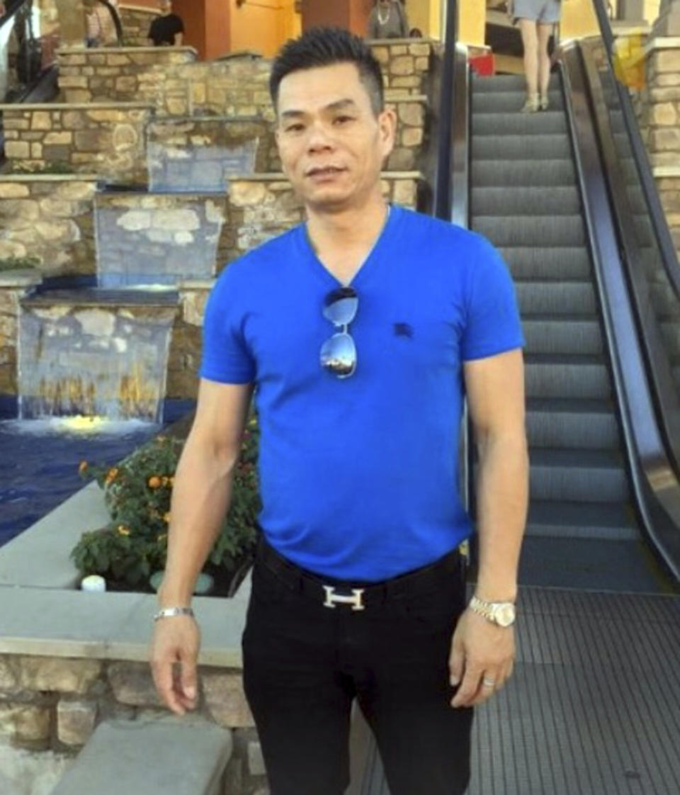 This undated family photo provided by the Cochran Firm shows Chinese immigrant Li Xi Wang at an unknown location. Wang, fatally shot by a Southern California police officer as he hid behind a door during a raid on a marijuana growing operation, didn’t speak English and likely didn't understand he was being told to show his hands, lawyers for the man’s family said Wednesday, Aug. 28, 2019, in alleging the officer had no reason to open fire. (Wang Family via AP)