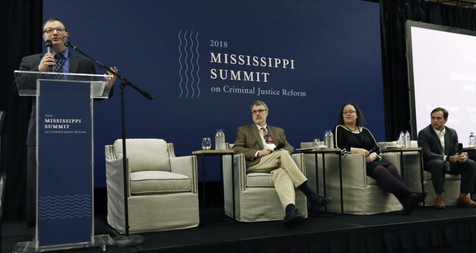 Marc Levin, vice president of Criminal Justice Policy: Right on Crime, left, leads a panel discussion on criminal justice reform, at the Mississippi Summit on Criminal Justice Reform in Jackson, Miss., Tuesday, Dec. 11, 2018. Among the panelists were University of Tennessee professor David Hughes, second from left, Joanna Weis, co-director of Fees and Fines Justice Center, second from right, and Louisiana Rep. Tanner Magee, R-Houma. The discussion was one of several during a meeting put on by a coalition of groups that favor changes to reduce harshness in the criminal justice system. (AP Photo/Rogelio V. Solis)