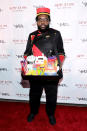 <p>The Roots drummer literally was the candy man in his movie-usher uniform. (Photo: Neilson Barnard/Getty Images for Heidi Klum) </p>