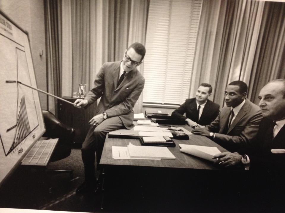 During his illustrious banking career, when Aubrey Lee Sr. provided instruction, people listened, including Dave Bing (seated across from Lee) during the early days of his Detroit Pistons career, when Bing worked an off-season job at NBD Bank.