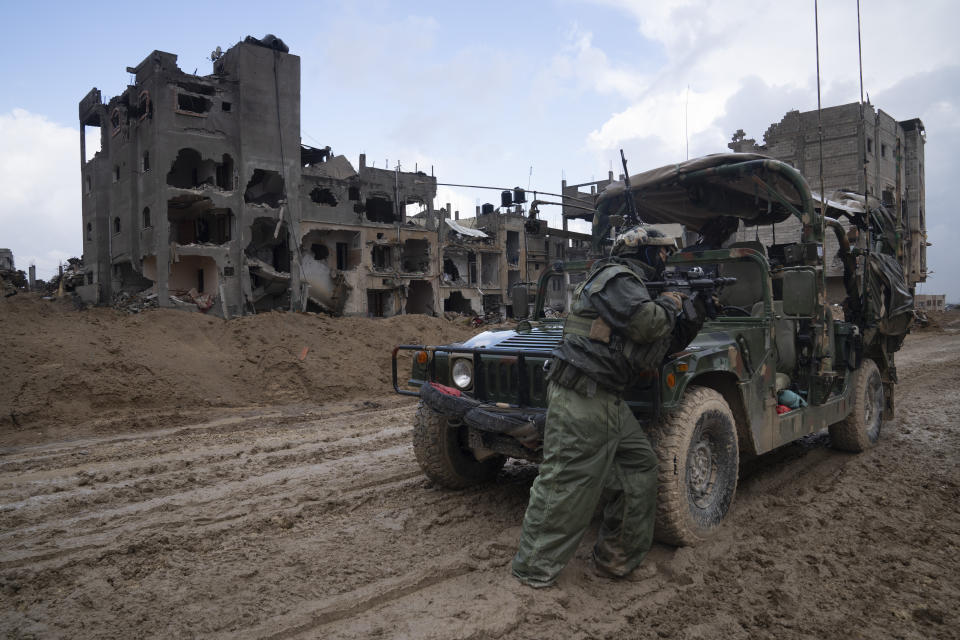 An Israeli soldier stands guard during the ground offensive on the Gaza Strip in Khan Younis, Saturday, Jan. 27, 2024. (AP Photo/Sam McNeil)