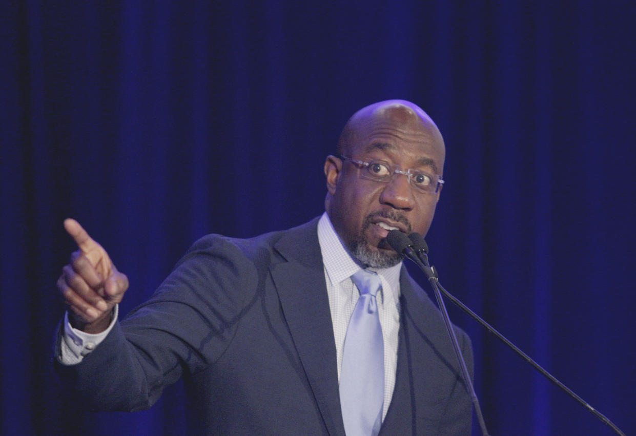 FILE - Sen. Raphael Warnock, D-Ga., speaks at the Gwinnett County Democratic Party fundraiser on May 21, 2022 in Norcross, Ga. Four years ago, Georgia Democrats had a contested primary for governor because the party old guard didn't believe in Stacey Abrams. She blew away the elders' alternative and, in a close general election loss, established herself as de facto party boss in a newfound battleground. (AP Photo/Akili-Casundria Ramsess, File)