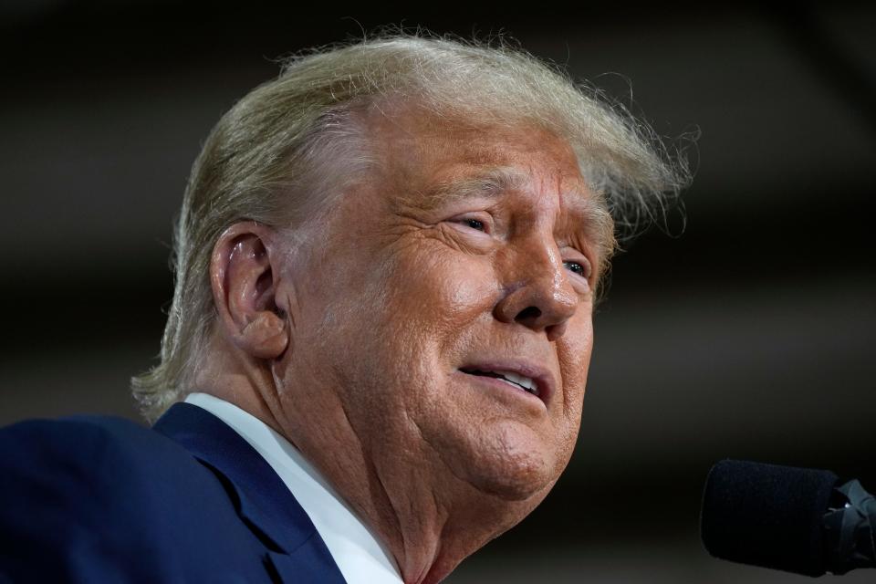 Former President Donald Trump speaks during a commit to caucus rally, Monday, Oct. 16, 2023, in Adel, Iowa. (AP Photo/Charlie Neibergall)