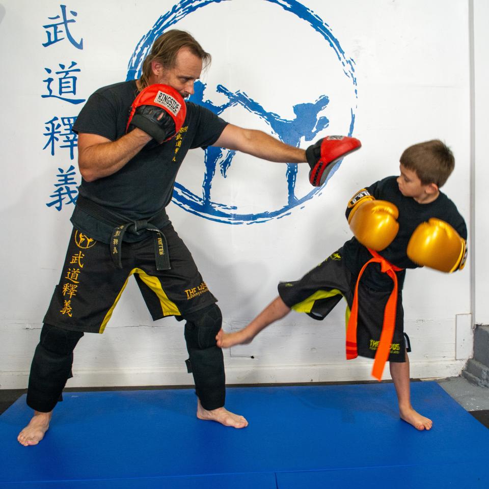 Instructor and student sparring lesson