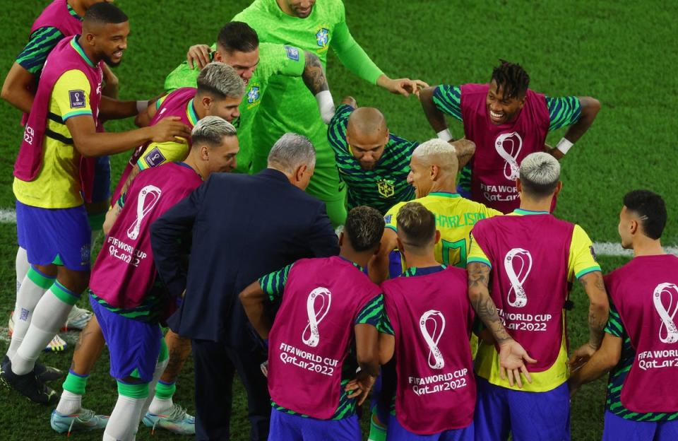 Tite dances with Richarlison and Brazilian teammates (Reuters)