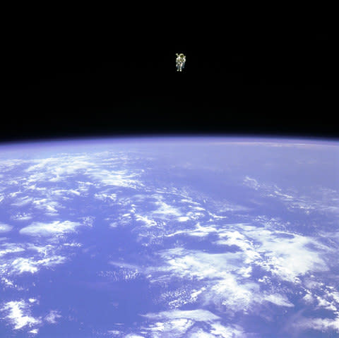 NASA, astronaut Bruce McCandless uses a nitrogen jet-propelled backpack - Credit: NASA/AP