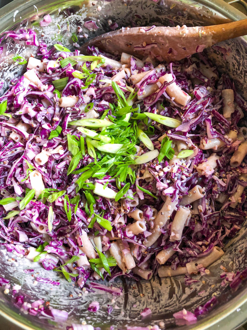 Sesame pasta salad in a large mixing bowl before getting combined