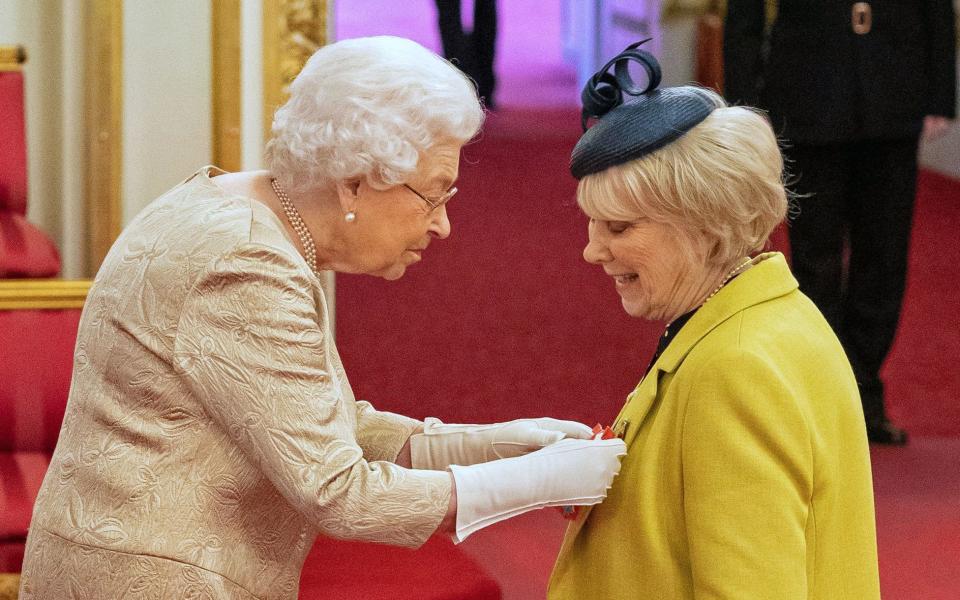 File photo dated 03/03/20 of Queen Elizabeth II wearing gloves as she awards the CBE to Miss Anne Craig, known professionally as actress Wendy Craig, during an investiture ceremony at Buckingham Palace in London. The Queen's upcoming visits to Cheshire and Camden have been postponed because of the coronavirus pandemic, Buckingham Palace has announced. PA Photo. Issue date: Friday March 13, 2020. See PA story ROYAL Queen. Photo credit should read: Dominic Lipinski/PA Wire - Dominic Lipinski/PA Wire