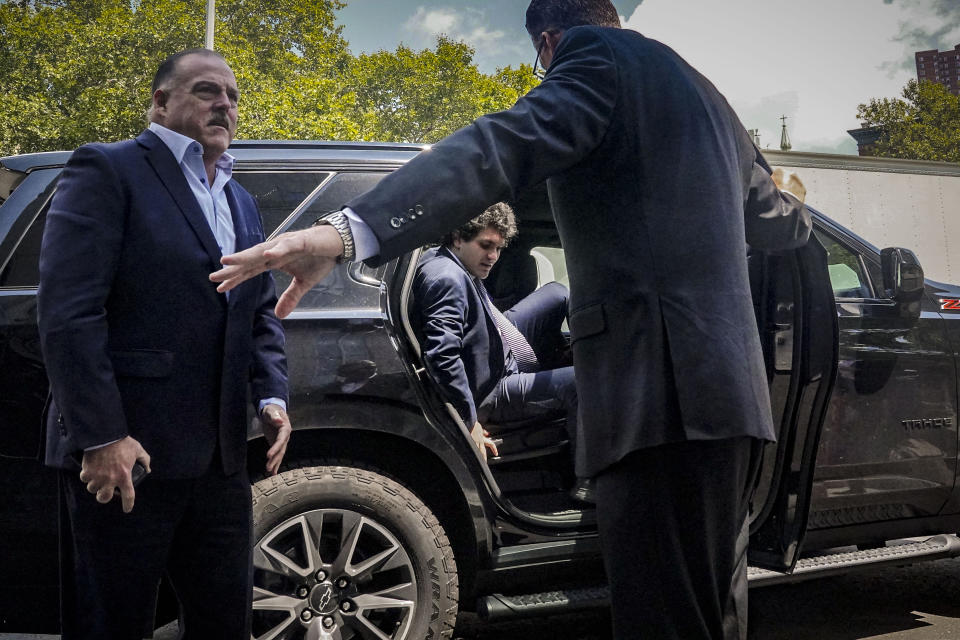 FTX founder Sam Bankman-Fried, center, arrives at Manhattan federal court, Friday, Aug. 11, 2023, in New York. Bankman-Fried returned to New York City for a bail hearing Friday that could decide whether the fallen cryptocurrency wiz must go to jail while he awaits trial. (AP Photo/Bebeto Matthews)