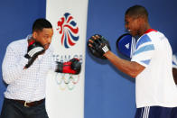 Actor Will Smith boxes with Great Britain Olympic Super Heavyweight boxer Anthony Joshua at Ethos gym in London, Wednesday, May 16, 2012. (AP Photo/Jim Ross)