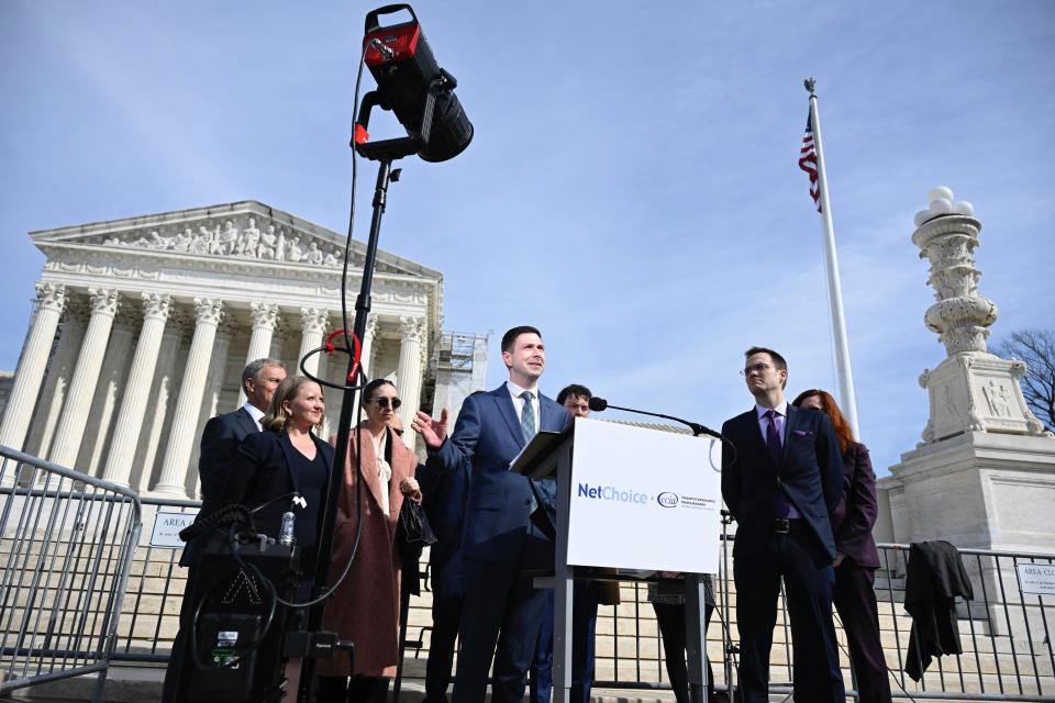 Chris Marchese (C), Director of NetChoice Litigation Center, speaks to the press outside the U.S. Supreme Court in Washington, D.C., on Feb. 26, 2024. In a case that could determine the future of social media, the Supreme Court was asked today to decide whether a pair of state laws that limit content moderation are constitutional.