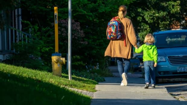 A family walks to school in Ottawa on Sept. 13, 2021, during the COVID-19 pandemic.  (Francis Ferland/CBC - image credit)
