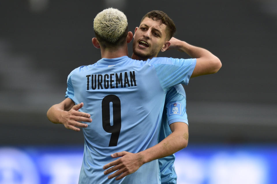 Israel's Ahmad Ibrahim, behind, celebrates with teammate Dor Turgeman after an own goal scored by Senegal's Babacar Ndiaye at a FIFA U-20 World Cup Group C soccer match at Diego Maradona stadium in La Plata, Argentina, Wednesday, May 24, 2023. (AP Photo/Gustavo Garello)