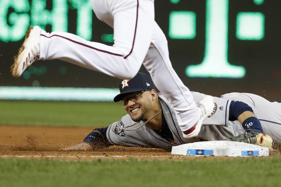 Houston Astros first baseman Yuli Gurriel forces out Washington Nationals' Trea Turner at first during the sixth inning of Game 5 of the baseball World Series Sunday, Oct. 27, 2019, in Washington. (AP Photo/Jeff Roberson)