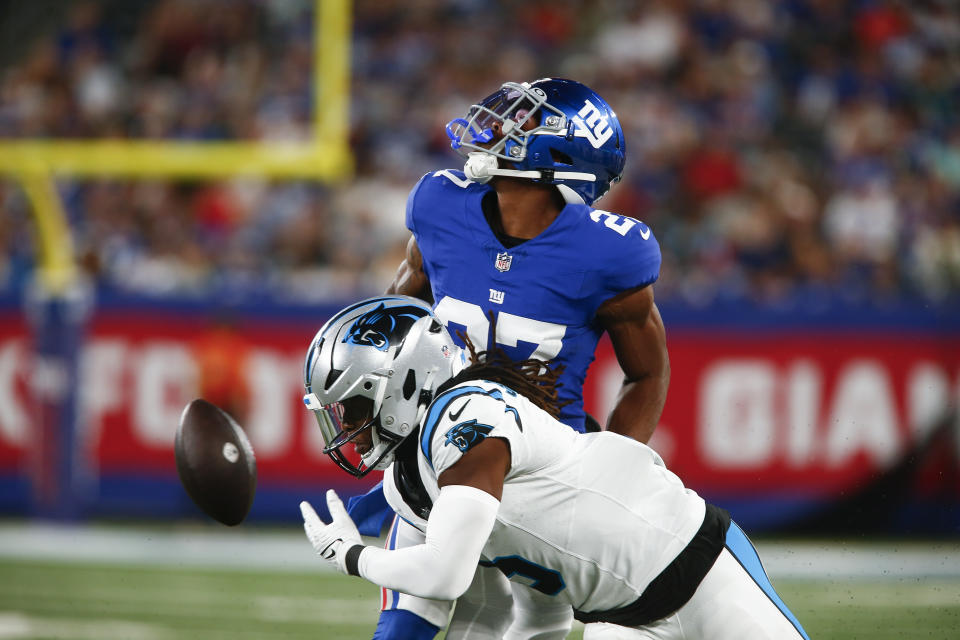 Carolina Panthers' Laviska Shenault Jr., bottom, can't make the catch while being guarded by New York Giants' Jason Pinnock during the first half of an NFL preseason football game, Friday, Aug. 18, 2023, in East Rutherford, N.J. (AP Photo/John Munson)