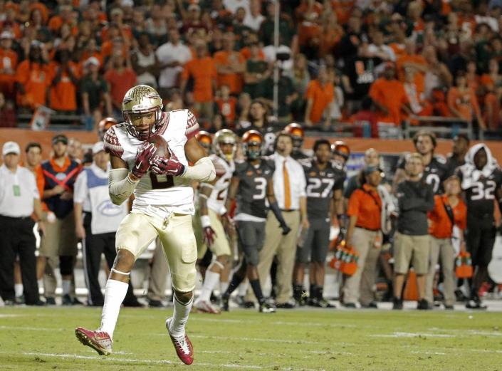 Florida State Seminoles defensive back Jalen Ramsey (#8) makes the game-ending interception against the Miami Hurricanes in the fourth quarter at SunLife Stadium in Miami Gardens on Sunday, November 16, 2014. Jon Durr/Miami Herald Staff