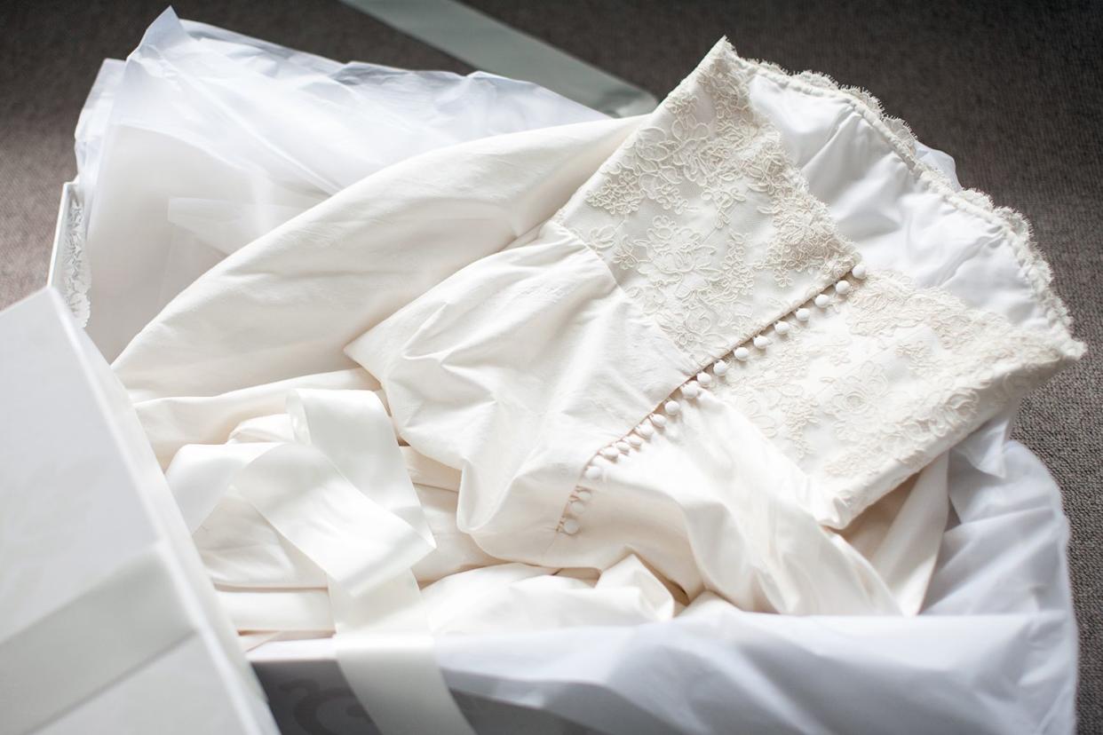 <p>Tom Merton/Getty</p> Wedding dress preserved in a box