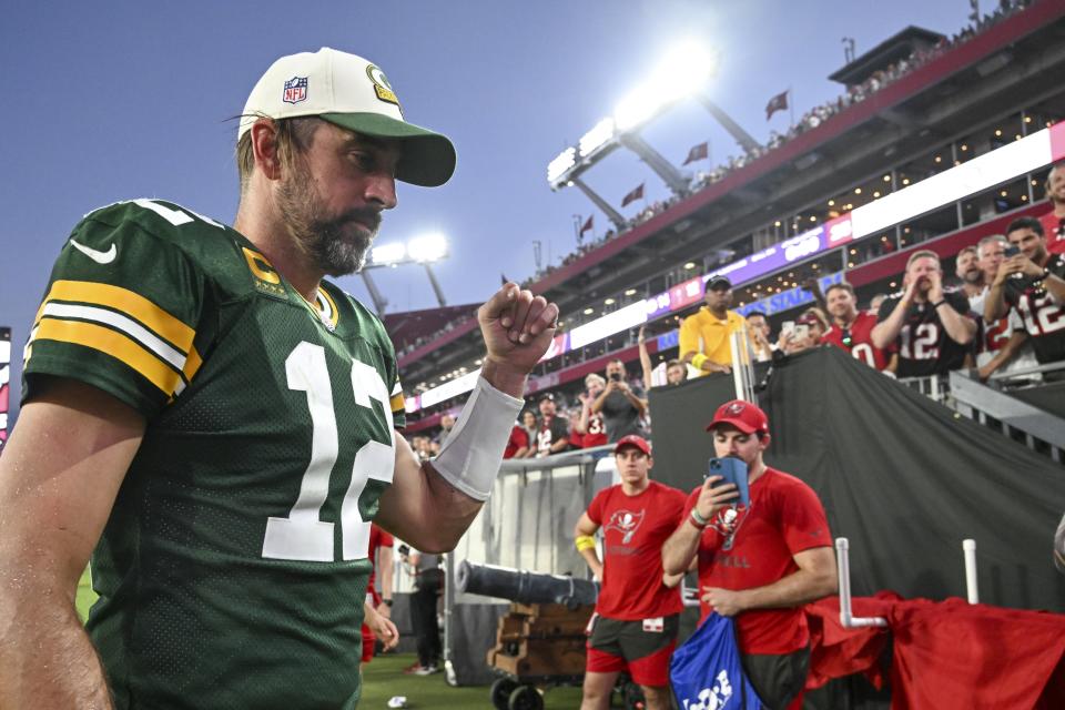 Green Bay Packers' Aaron Rodgers reacts as he walks off the field after an NFL football game against the Tampa Bay Buccaneers Sunday, Sept. 25, 2022, in Tampa, Fla. The Packers won 14-12. (AP Photo/Jason Behnken)