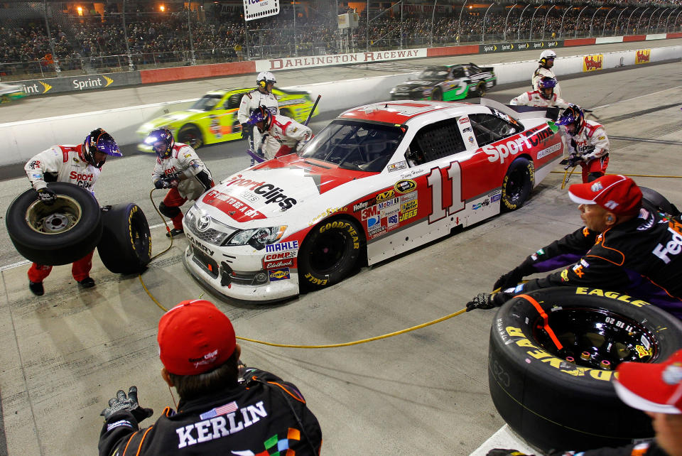 DARLINGTON, SC - MAY 12: Denny Hamlin, driver of the #11 Sport Clips Toyota, pits during the NASCAR Sprint Cup Series Bojangles' Southern 500 at Darlington Raceway on May 12, 2012 in Darlington, South Carolina. (Photo by Geoff Burke/Getty Images for NASCAR)